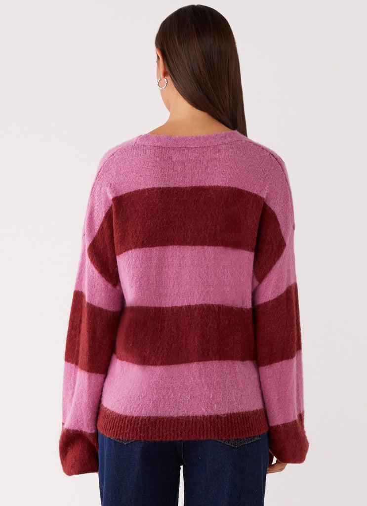 Womens Ainslee Oversized Knit Cardigan in the colour Red Pink Stripe in front of a light grey background