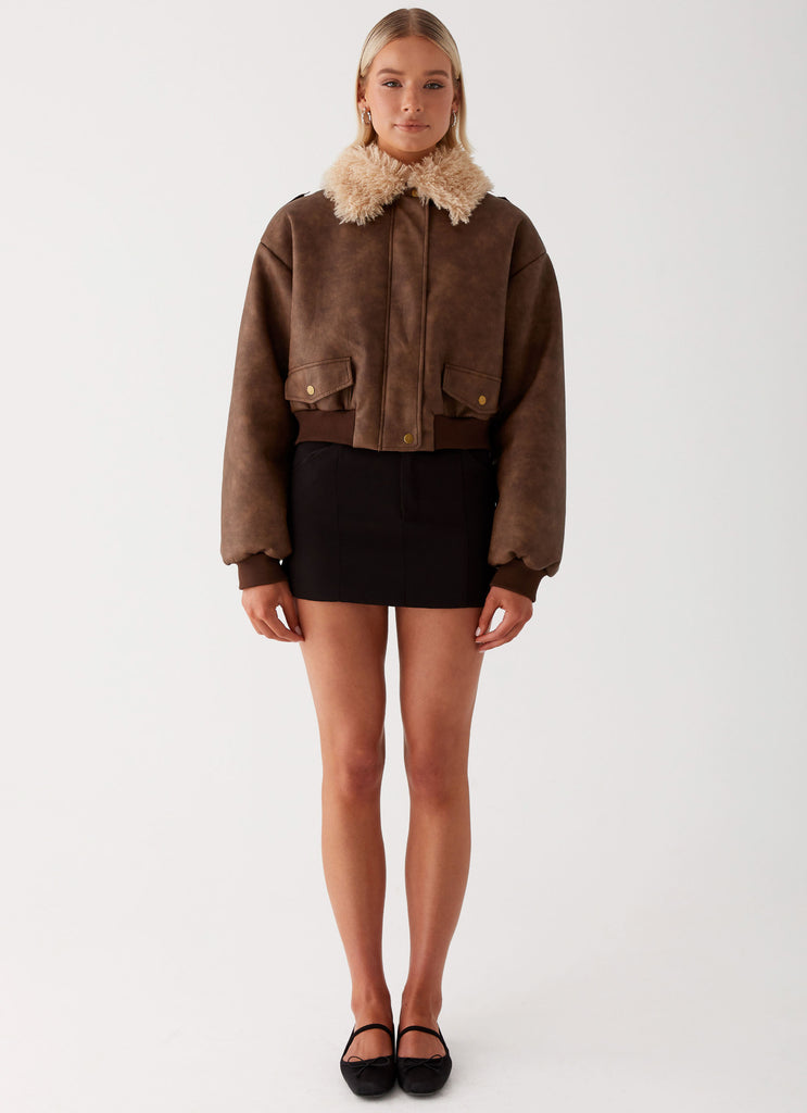 Womens Aston Shearling Bomber Jacket in the colour Brown in front of a light grey background