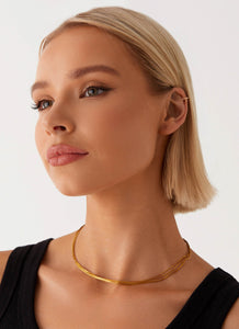 Womens Head Held High Necklace in the colour Gold in front of a light grey background