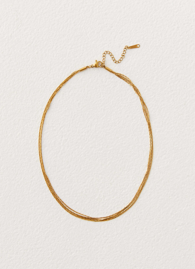 Womens Head Held High Necklace in the colour Gold in front of a light grey background