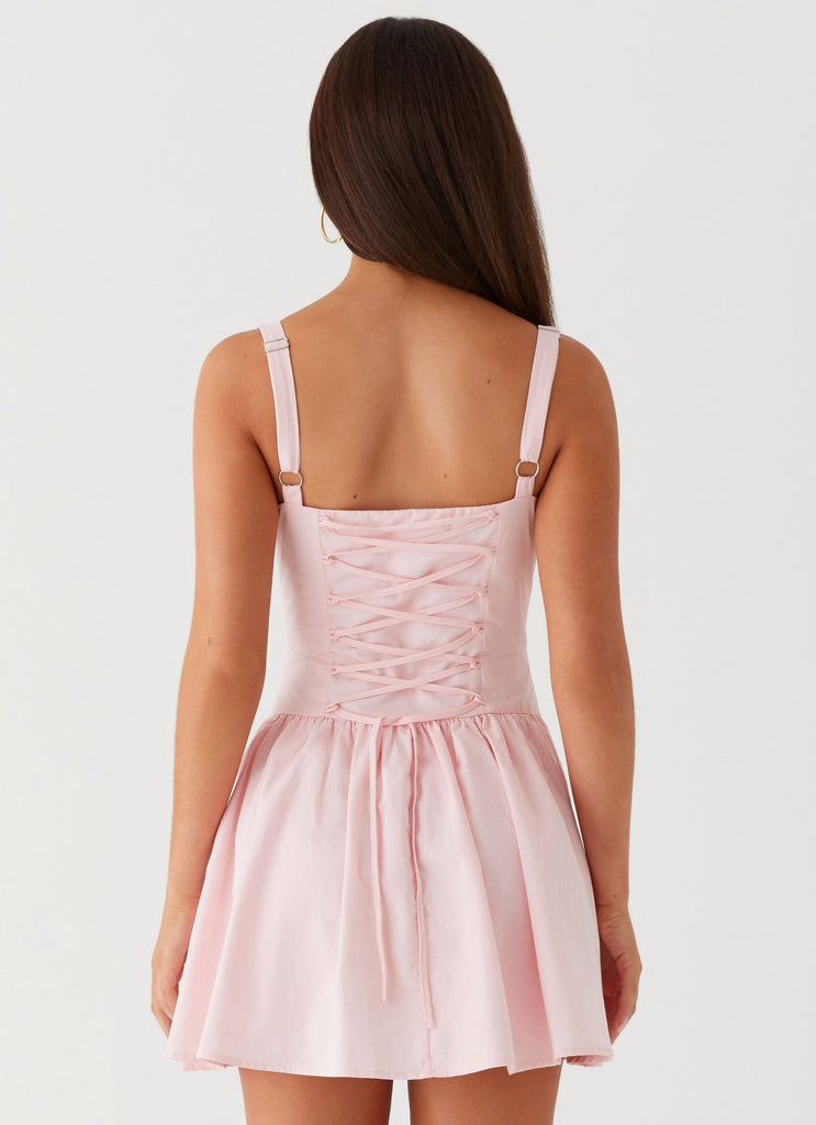 Womens Juno Mini Dress in the colour Pink in front of a light grey background