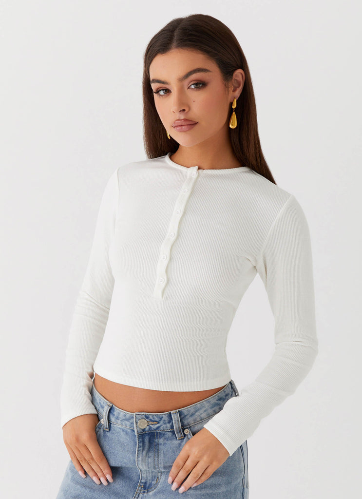 Womens Kellie Long Sleeve Knit Top in the colour White in front of a light grey background