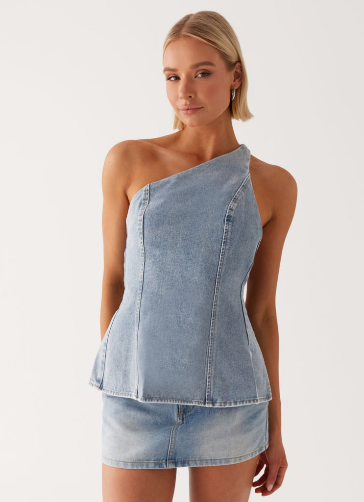 Womens Maysa Denim Top in the colour Blue in front of a light grey background