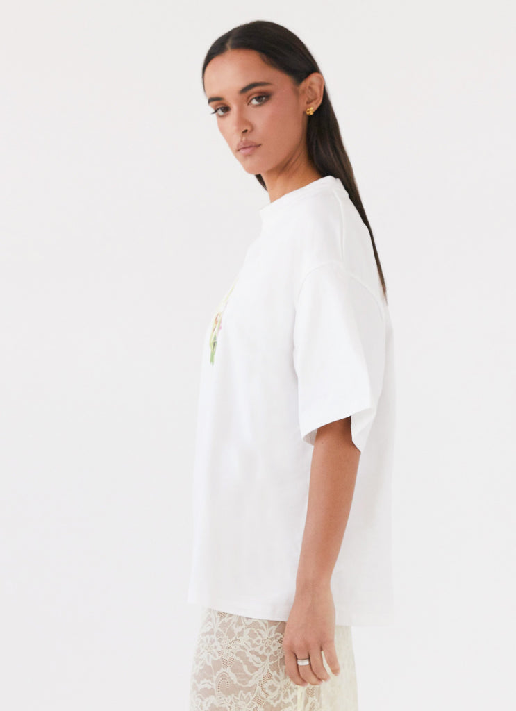 Womens Lillies Oversized Tee in the colour White in front of a light grey background