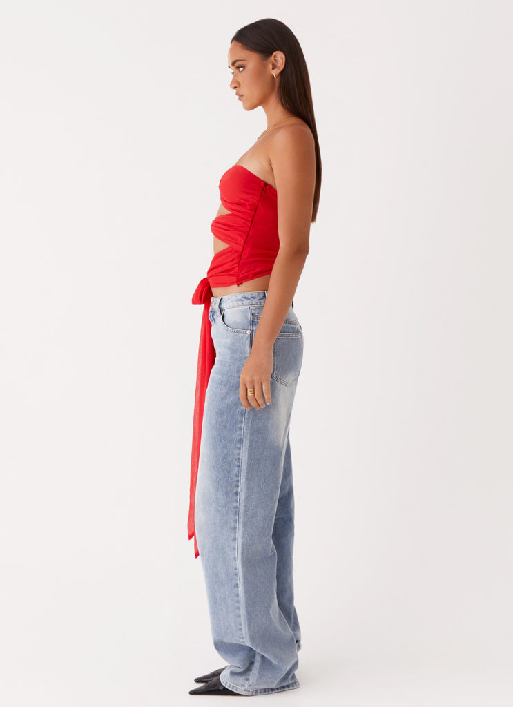 Womens Sunlight Cascade Top in the colour Red in front of a light grey background