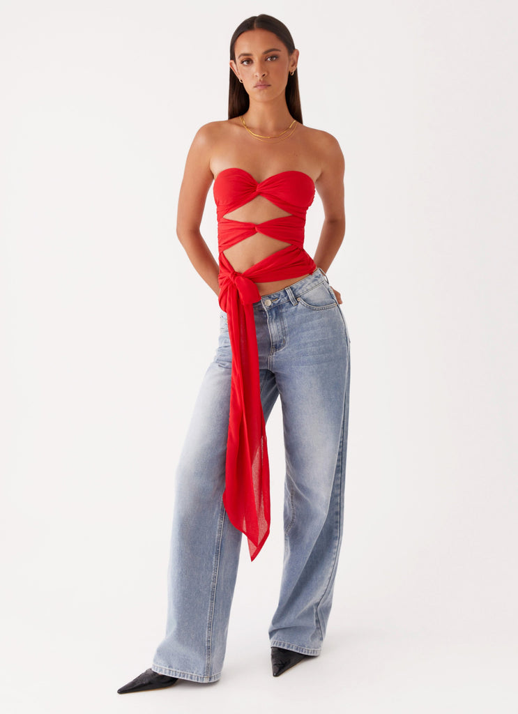 Womens Sunlight Cascade Top in the colour Red in front of a light grey background