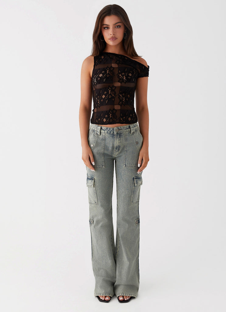 Womens Zephee Flare Jeans in the colour Washed Denim in front of a light grey background