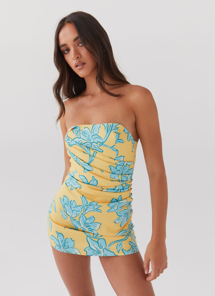 Womens Tuscany Mini Dress in the colour Golden Bloom in front of a light grey background