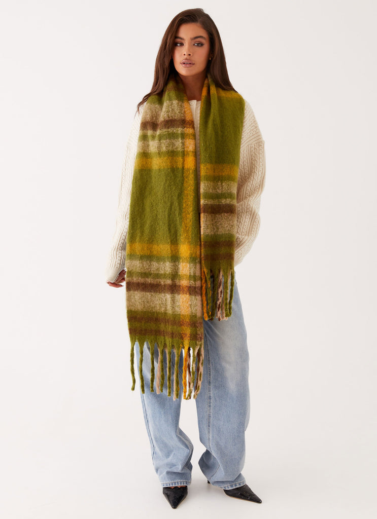 Womens Rainier Plaid Scarf in the colour Green in front of a light grey background