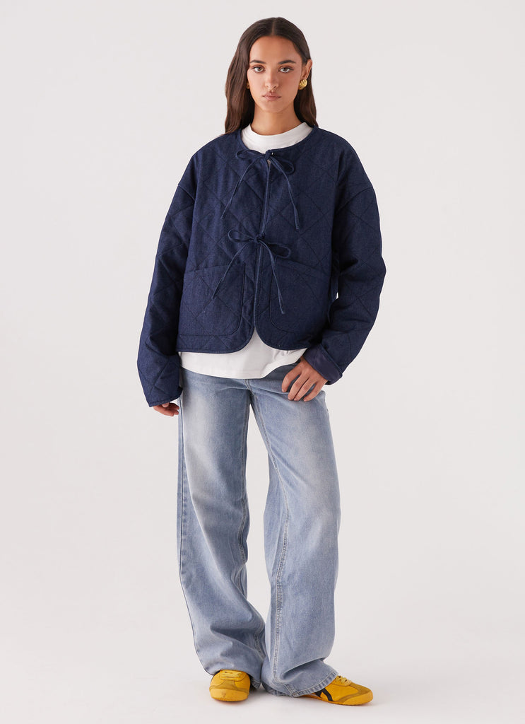 Womens Faded Fall Quilted Jacket in the colour Vintage Blue Wash in front of a light grey background