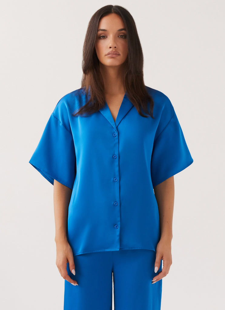 Womens Palm Cove Satin Shirt in the colour Cobalt in front of a light grey background