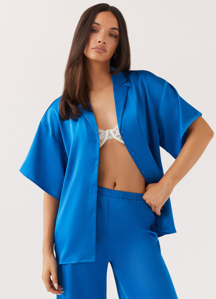 Womens Palm Cove Satin Shirt in the colour Cobalt in front of a light grey background