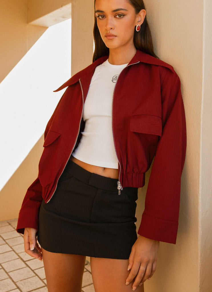 Womens Right Direction Oversized Bomber Jacket in the colour Deep Red in front of a light grey background