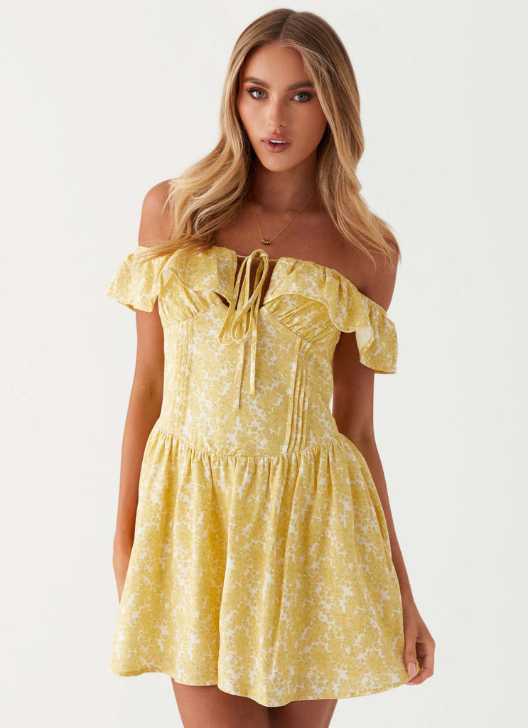 Womens Tarryn Mini Dress in the colour Yellow Floral in front of a light grey background