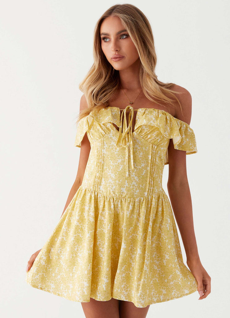 Womens Tarryn Mini Dress in the colour Yellow Floral in front of a light grey background