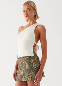 Womens Tonnie Floral Mini Skirt in the colour Brown Floral in front of a light grey background