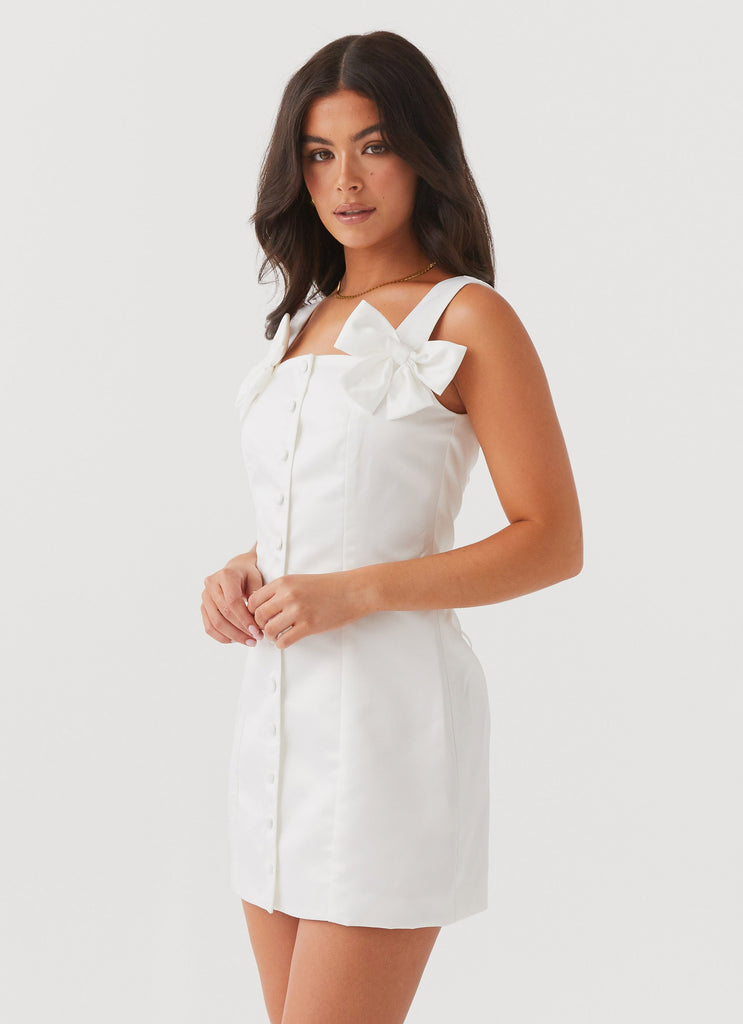 Womens Brielle Bow Satin Mini Dress in the colour White in front of a light grey background