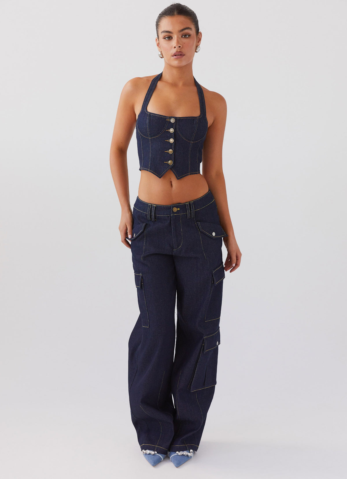 Womens Avari Halterneck Denim Vest in the colour Indigo in front of a light grey background