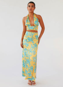 Womens Amalia Satin Maxi Skirt in the colour Golden Bloom in front of a light grey background