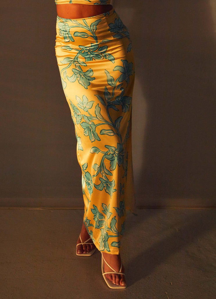 Womens Amalia Satin Maxi Skirt in the colour Golden Bloom in front of a light grey background