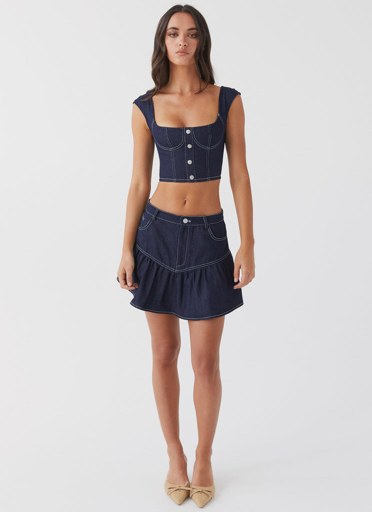 Womens Isabella Denim Bustier Top in the colour Indigo in front of a light grey background