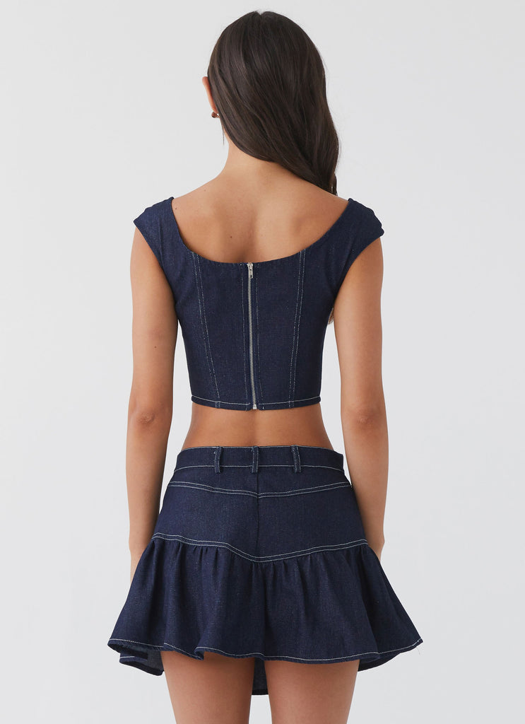 Womens Isabella Denim Bustier Top in the colour Indigo in front of a light grey background