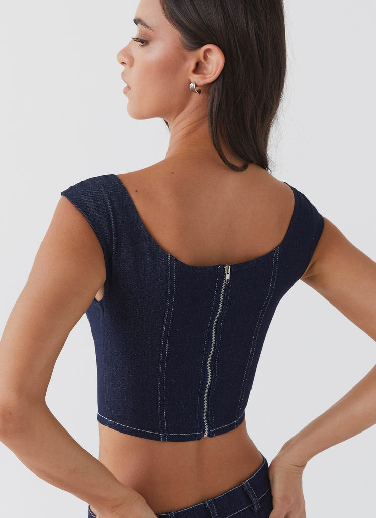 Womens Isabella Denim Bustier Top in the colour Indigo in front of a light grey background